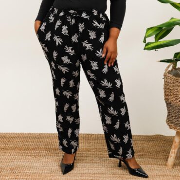 Pantalon fluide femme taille élastique noir à imprimé feuille taille élastique | mode femme ronde